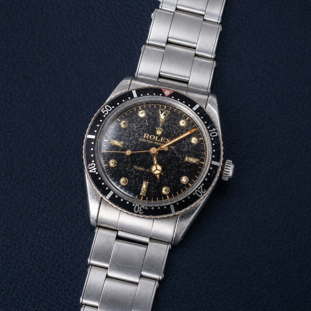 Vintage Rolex Turn-O-Graph reference 6202 on dark navy leather, hero view